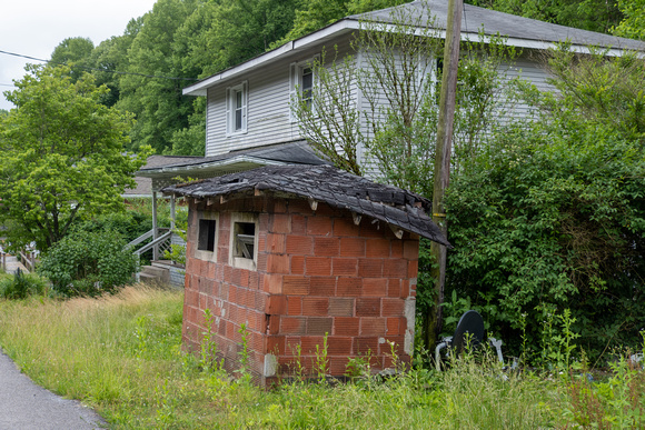 Coal was delivered to each home and put into one of these "brick" sheds in the front yard.